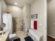 A neutral toned bathroom featuring a walk-in shower with safety bars at 1336 Oakmont Dr, Winter Haven, FL 33884