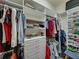 Well-organized walk-in closet with ample shelving, drawers, and hanging space for clothing and accessories at 1336 Oakmont Dr, Winter Haven, FL 33884