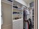 Organized walk-in closet with ample shelving, drawers, and hanging space for clothing and accessories at 1336 Oakmont Dr, Winter Haven, FL 33884