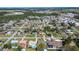 Aerial shot showing the home's location in a residential neighborhood with mature trees at 139 Jackson St, Lake Wales, FL 33859