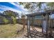 Tranquil backyard featuring a charming pergola over a brick-laid area and surrounded by greenery at 139 Jackson St, Lake Wales, FL 33859