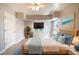 Cozy bedroom with a large bed, dresser, television, and decor at 139 Jackson St, Lake Wales, FL 33859