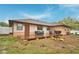 Cozy backyard featuring a wooden deck, outdoor seating, and a barbecue grill for entertaining at 1412 Covington Ct, Lake Wales, FL 33853