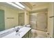Bathroom featuring a sink and glass shower at 1412 Covington Ct, Lake Wales, FL 33853