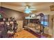 Bedroom with loft bed, desk, dresser and unique wall design at 1412 Covington Ct, Lake Wales, FL 33853