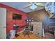 Bedroom featuring a black and red geometric wall design, desk, and loft bed at 1412 Covington Ct, Lake Wales, FL 33853