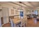 Bright dining room with a modern light fixture, seating for six, and stylish decor at 1412 Covington Ct, Lake Wales, FL 33853