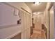 Hallway features coat closet, bi-fold door laundry and a neutral color scheme at 1412 Covington Ct, Lake Wales, FL 33853