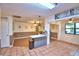 Spacious kitchen and dining area with tile floors and access to pantry and living space at 1412 Covington Ct, Lake Wales, FL 33853