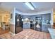 Well-equipped kitchen featuring stainless steel appliances, modern cabinets, and tiled floor at 1412 Covington Ct, Lake Wales, FL 33853