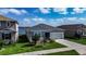 Charming home surrounded by lush greenery and a glimpse of the serene lake nearby; perfect location! at 153 Summershore Dr, Auburndale, FL 33823