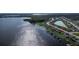 Aerial view of lakefront community, highlighting waterfront homes with private docks and lush landscaping at 153 Summershore Dr, Auburndale, FL 33823