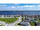 Panoramic view of a residential area with lakefront properties, docks, and beautiful lakeside scenery at 153 Summershore Dr, Auburndale, FL 33823