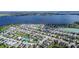 Lakeside community featuring beautiful homes with manicured lawns and private boat docks along the tranquil waterfront at 153 Summershore Dr, Auburndale, FL 33823