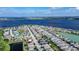 Picturesque aerial view of a waterfront community, showcasing modern homes and serene lake access at 153 Summershore Dr, Auburndale, FL 33823