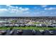 Drone shot of a waterfront neighborhood, featuring homes with boat docks along the lake at 153 Summershore Dr, Auburndale, FL 33823