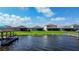 Scenic view of waterfront homes with docks extending into the lake, offering serene backyard views at 153 Summershore Dr, Auburndale, FL 33823