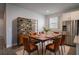 Inviting dining area with industrial-style shelving, dining table with six chairs, and natural light at 153 Summershore Dr, Auburndale, FL 33823