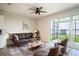 Stylish living room with comfortable seating, an elegant rug, and a serene view of the water at 153 Summershore Dr, Auburndale, FL 33823