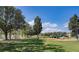 Community playground with play structures, benches and large open field at 153 Summershore Dr, Auburndale, FL 33823