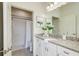 Clean bathroom featuring granite countertops, a walk-in shower, and modern fixtures for a luxurious experience at 1703 Linz Ct, Winter Haven, FL 33884