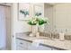 Well-lit bathroom featuring granite countertops, modern fixtures, and stylish decor at 1703 Linz Ct, Winter Haven, FL 33884