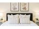 Stylish bedroom features abstract art, accent lamps, and plush pillows at 1703 Linz Ct, Winter Haven, FL 33884