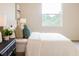 Bright bedroom featuring plush bedding, decorative pillows, and picturesque natural light at 1703 Linz Ct, Winter Haven, FL 33884