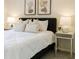Bright bedroom with neutral decor, soft carpet, and decorative pillows and lamps at 1703 Linz Ct, Winter Haven, FL 33884