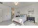 Well-lit bedroom featuring neutral tones, tasteful decor, and an ensuite bathroom for added convenience at 1703 Linz Ct, Winter Haven, FL 33884