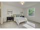 Bright bedroom with a cozy bed, stylish nightstands, and ample natural light from the window at 1703 Linz Ct, Winter Haven, FL 33884