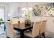 Elegant dining room with stylish furniture, a modern chandelier, and tasteful artwork for a sophisticated ambiance at 1703 Linz Ct, Winter Haven, FL 33884