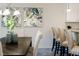 Cozy dining area with barstool seating, a well-lit chandelier, and modern decor for casual dining at 1703 Linz Ct, Winter Haven, FL 33884