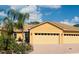 Inviting curb appeal with a well-manicured lawn and an attached three car garage at 1703 Linz Ct, Winter Haven, FL 33884