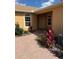 Charming home exterior featuring a brick walkway, well-maintained landscaping, and a welcoming entryway at 1703 Linz Ct, Winter Haven, FL 33884