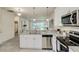 Well-lit kitchen featuring stainless steel appliances, granite counters, and an open layout at 1703 Linz Ct, Winter Haven, FL 33884
