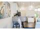 Contemporary kitchen with barstool seating, stainless steel appliances, and an open layout for entertaining guests at 1703 Linz Ct, Winter Haven, FL 33884