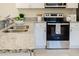 Modern kitchen featuring stainless steel appliances, granite countertops, and ample storage for cooking enthusiasts at 1703 Linz Ct, Winter Haven, FL 33884