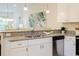 Open-concept kitchen with stainless steel appliances, a breakfast bar, and granite countertops at 1703 Linz Ct, Winter Haven, FL 33884