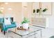 Bright living room with chic accent chair, modern buffet, and stylish glass coffee table at 1703 Linz Ct, Winter Haven, FL 33884