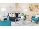 Inviting living room with a comfortable dark gray couch, stylish decor, and abundant natural light at 1703 Linz Ct, Winter Haven, FL 33884
