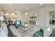 Spacious living area connects to the dining room, and features elegant decor and a light neutral color palette at 1703 Linz Ct, Winter Haven, FL 33884