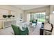 Bright living room with comfortable seating, leading to an outdoor patio with a scenic view and a connecting bedroom at 1703 Linz Ct, Winter Haven, FL 33884