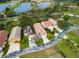 Lakefront homes from an aerial view showcase well-maintained lawns and proximity to a lake at 20143 Sunset Landing Ave, Groveland, FL 34736