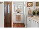 Elegant bathroom features a walk-in shower, unique sailboat decor, and tiled flooring at 20143 Sunset Landing Ave, Groveland, FL 34736