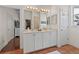 A bathroom with double vanity and abundant storage space for enhanced organization and convenience at 20143 Sunset Landing Ave, Groveland, FL 34736
