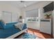 A well-lit bedroom with white ceiling fan and matching dressers create a calming and spacious atmosphere at 20143 Sunset Landing Ave, Groveland, FL 34736