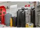 Well-equipped garage with a water filtration system and organized storage solutions at 20143 Sunset Landing Ave, Groveland, FL 34736