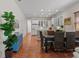 Spacious open living space with terracotta floors, ample natural light, and views of the backyard at 20143 Sunset Landing Ave, Groveland, FL 34736