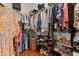 Organized walk-in closet with ample shelving and hanging space, providing smart storage solutions at 20143 Sunset Landing Ave, Groveland, FL 34736